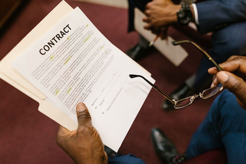 Closeup shot of a person holding a contract